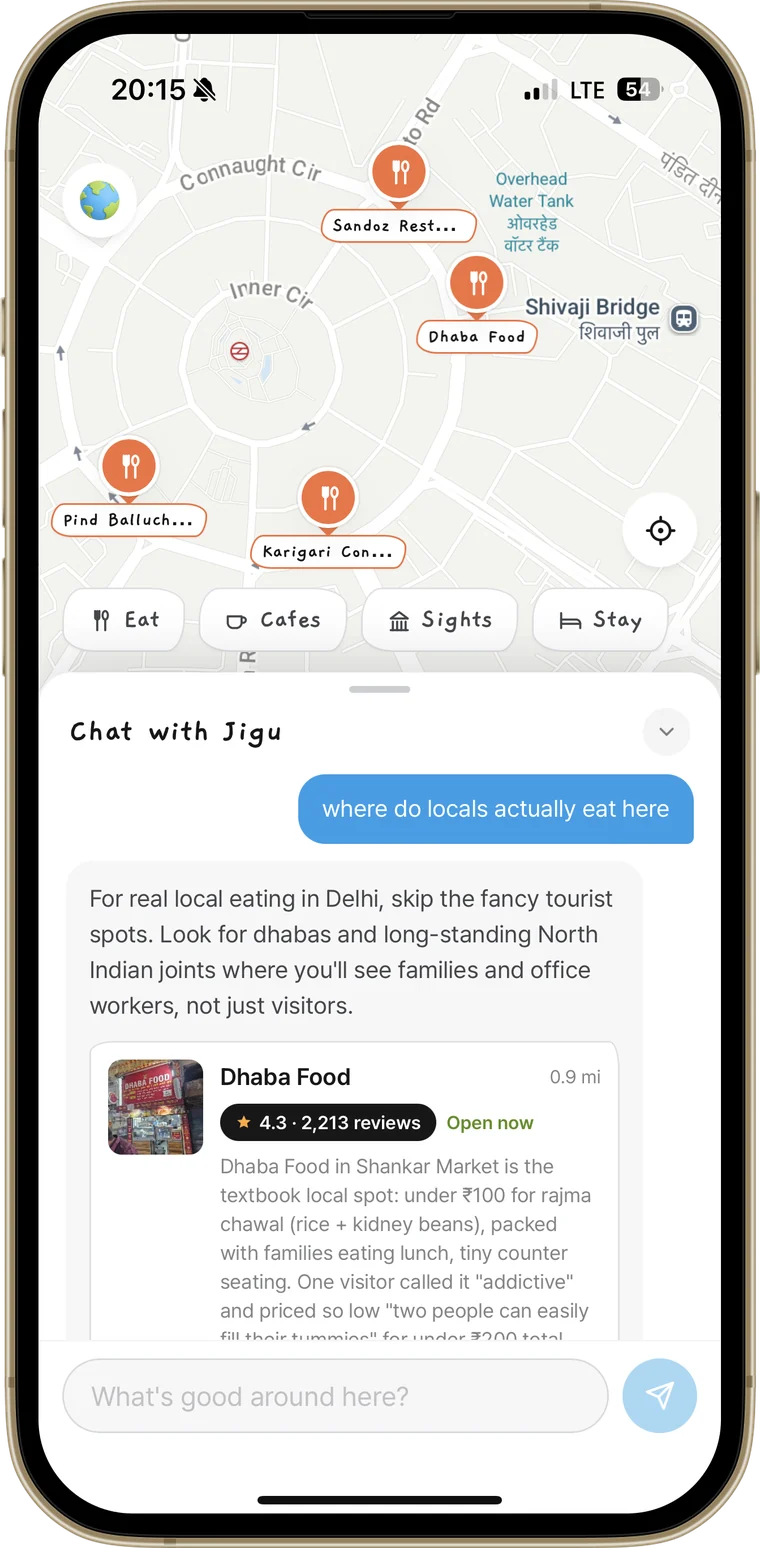 The JIGU chat answering a question about where locals eat, with a place card attached to the reply.